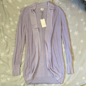 A SMALL LAVENDER COLORED CARDIGAN FROM A NEW DAY. NEVER WORN.